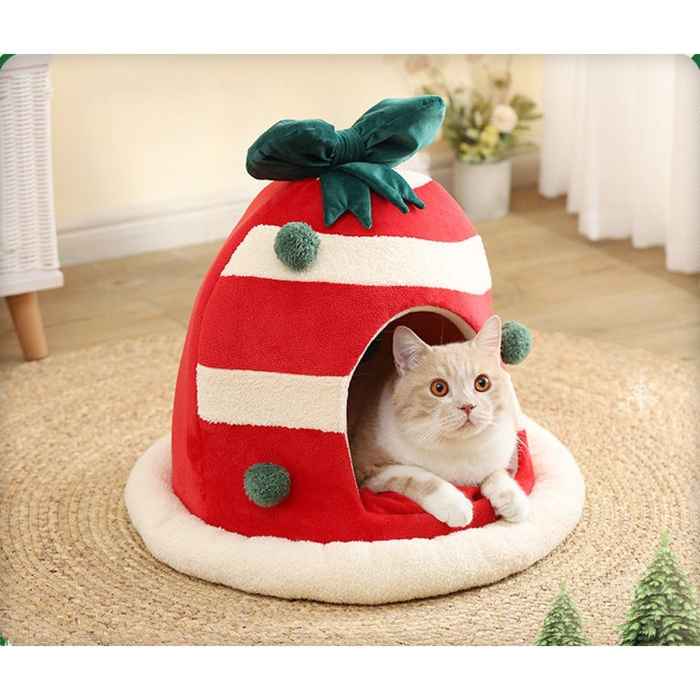 Enclosed Christmas cat nest with cat — holiday lifestyle photo
