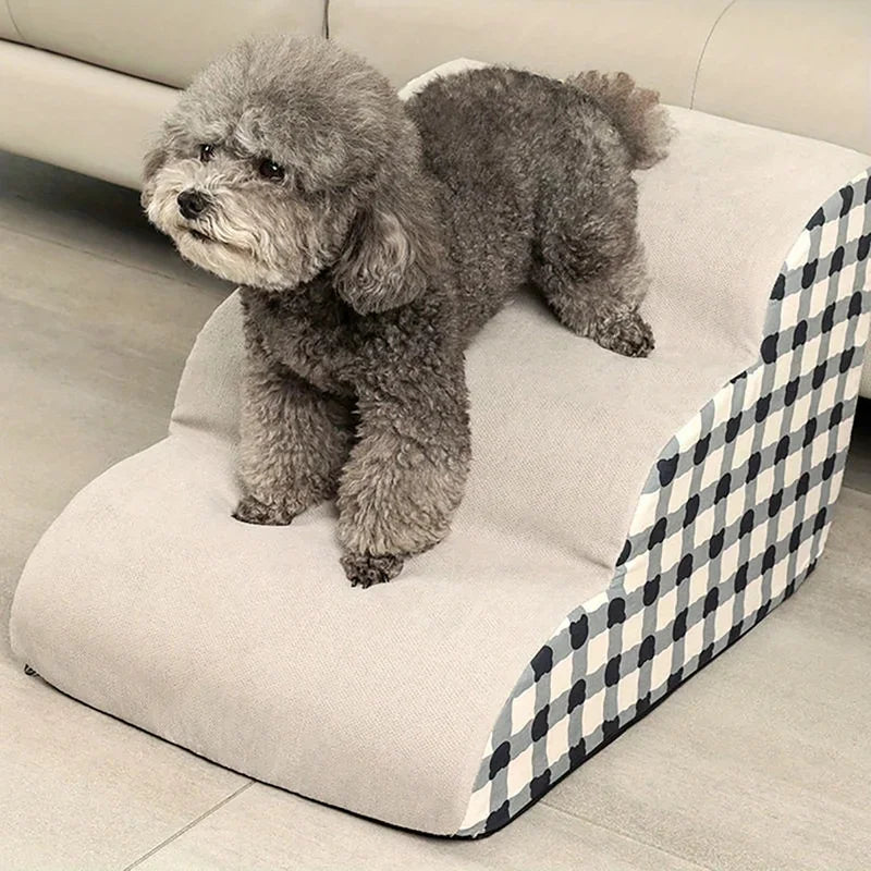 Gingham foam dog steps next to a sofa - photo 1